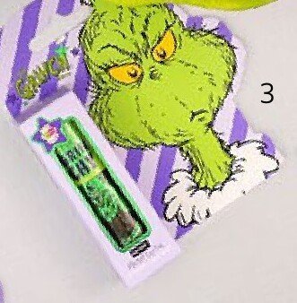 Olejek do ust z błyszczącymi drobinkami The Grinch  promocja w Rossmann